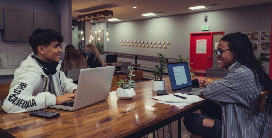 Professional advertising and PR consultation workspace with modern tools and strategic planning materials